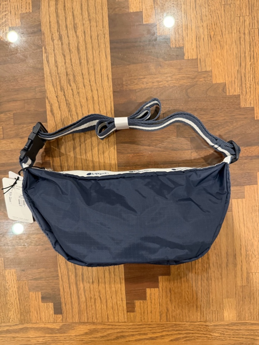Lesportsac Navy sling bag NWT